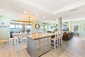 The kitchen Island can sit two people - Beachfront Home Sleeps 12 with Private Balcony and Grill (New Smyrna Beach)