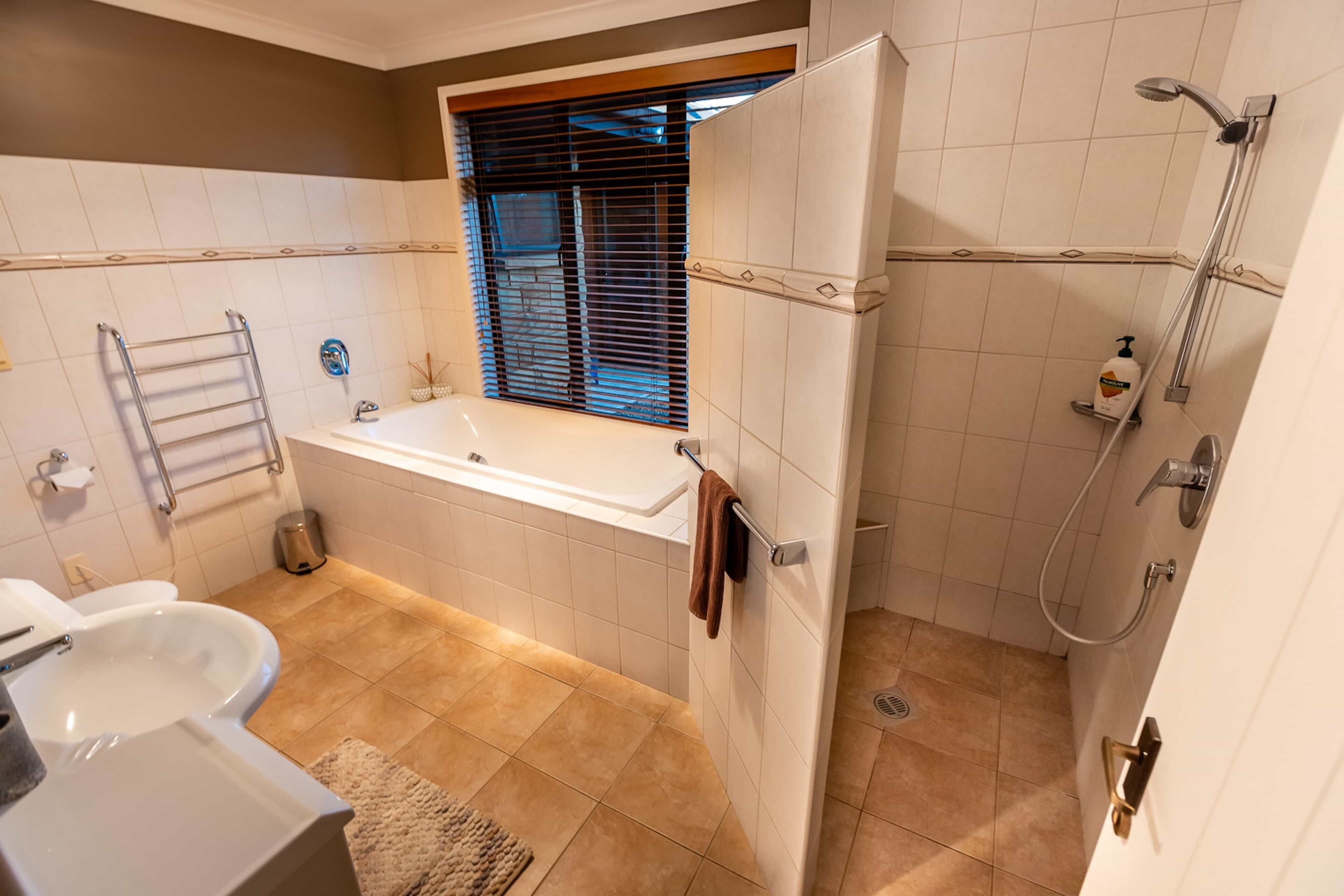 A bathroom with a bathtub, a shower, and a toilet.