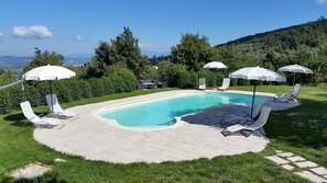 Outdoor pool, pool umbrellas, pool loungers