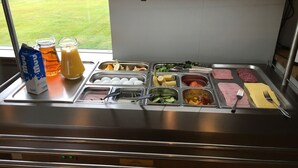 A breakfast buffet with various food options and beverages. - Dalakot (Budardalur)