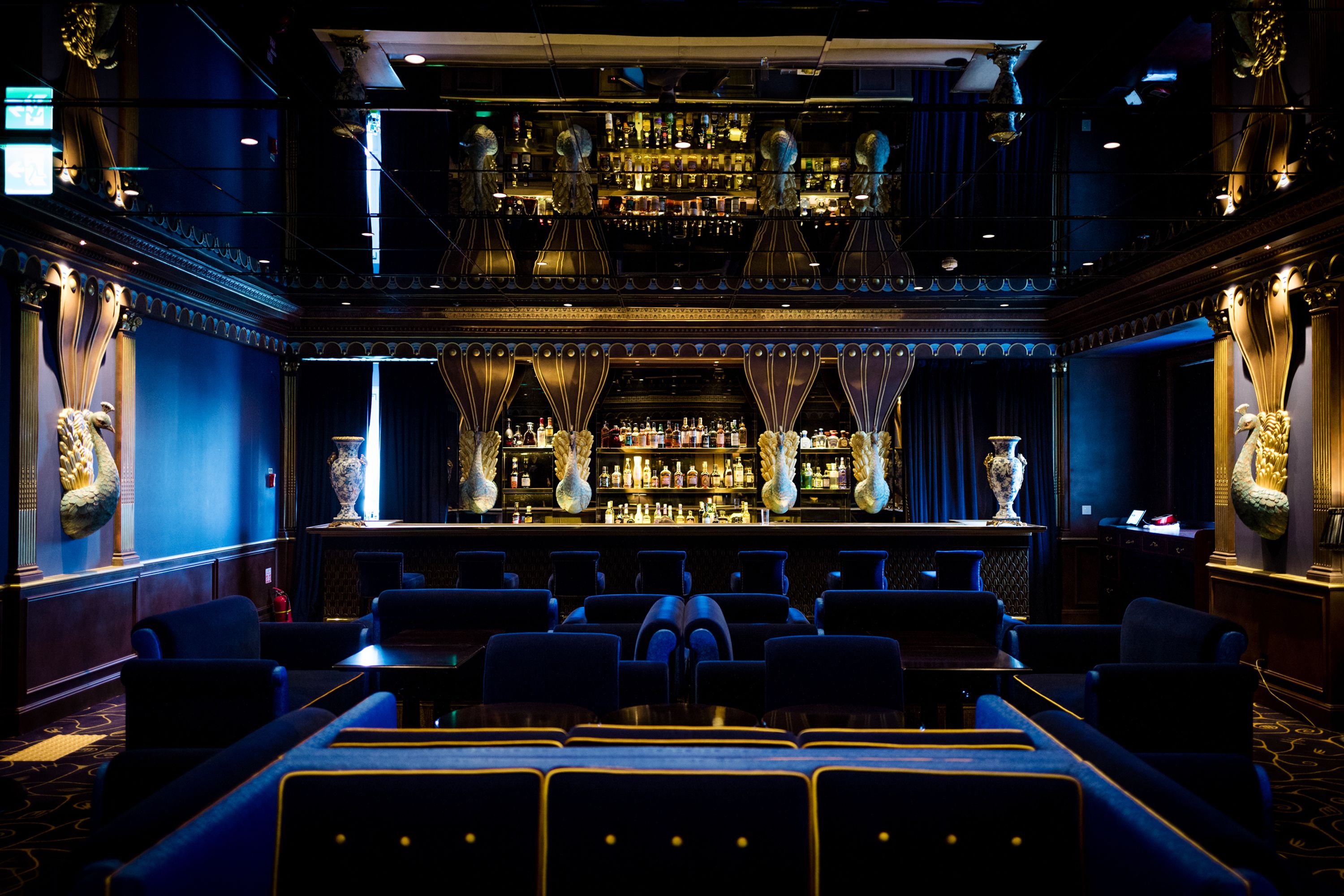 A bar area with seating and a bar counter.