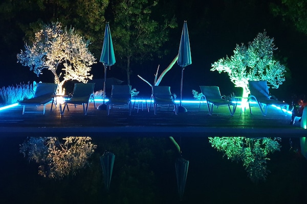 Seasonal outdoor pool, pool umbrellas, pool loungers