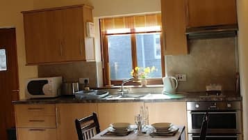 Cottage, 1 Bedroom | Private kitchen | Fridge, microwave, oven, stovetop