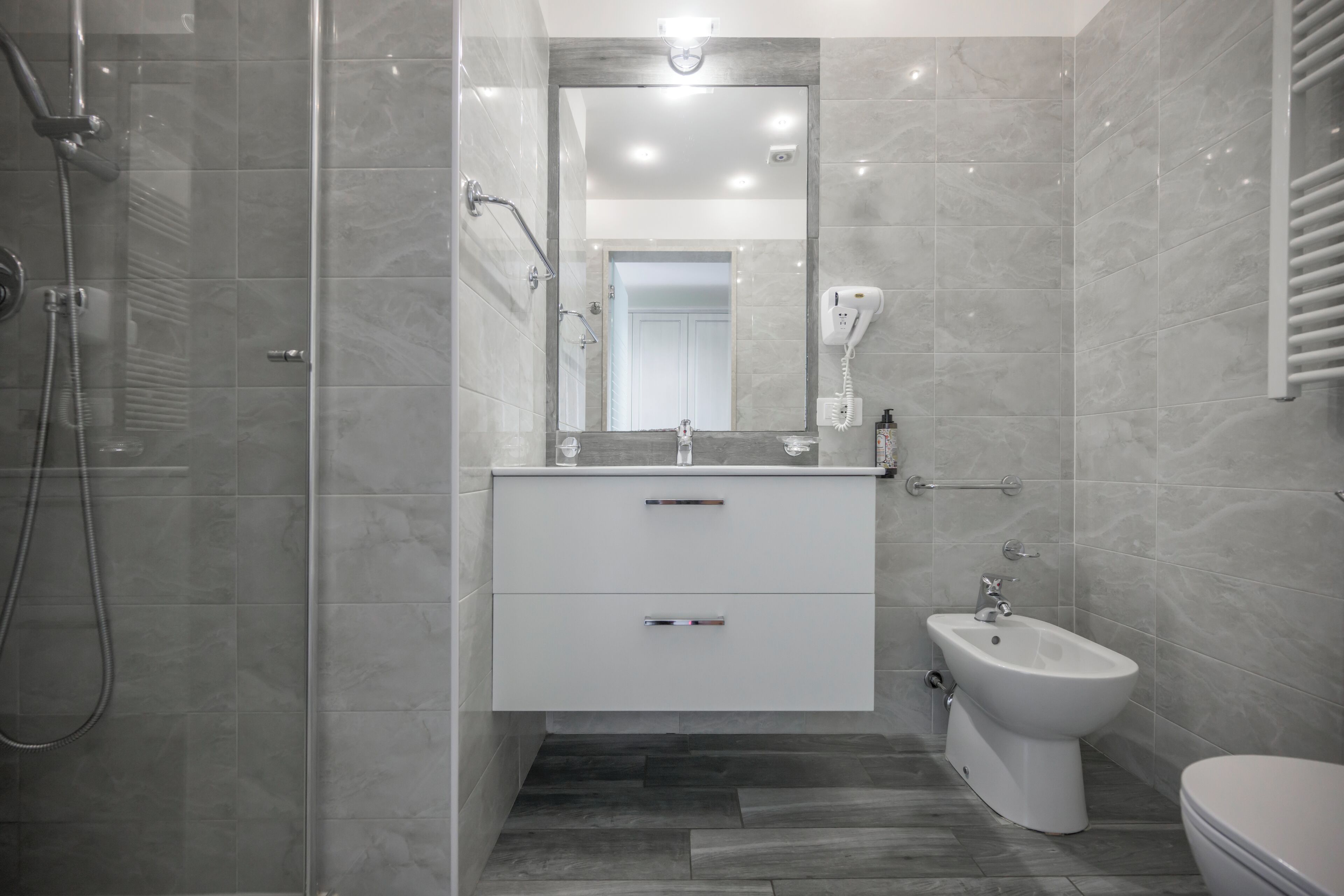 superior room, garden view | bathroom | shower, hair dryer, towels, soap