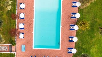 Outdoor pool, pool umbrellas, sun loungers
