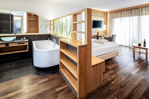 Deluxe Double Room | Living area | TV, toys, heated floors