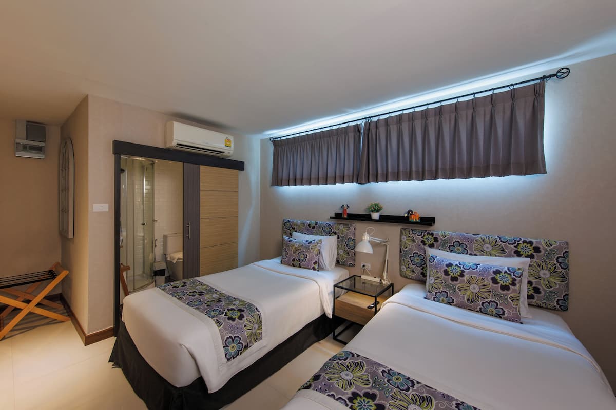 Habitación Deluxe con 2 camas individuales | Sábanas de algodón egipcio y ropa de cama de alta calidad
