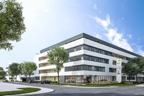 A modern multi-story building with a flat roof, large windows, and a sign indicating it is a residential park. - Hotel Vitus Steyr (Steyr)