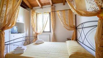 Apartamento, 2 quartos, terraço | 1 quarto, cortinas blackout, Wi-Fi de cortesia, roupa de cama