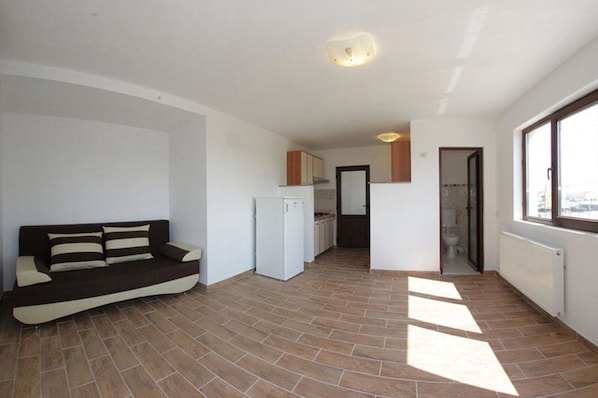 Apartamento conforto, sacada | Área de estar | TV de tela plana
