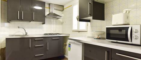 Apartment, 2 Bedrooms | Private kitchen | Full-size fridge, stovetop, cookware/dishes/utensils