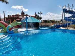 Enjoy a refreshing swim and thrilling water slide experience.