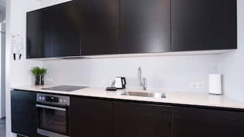 Studio, Multiple Beds | Private kitchen | Fridge, stovetop, coffee/tea maker, electric kettle