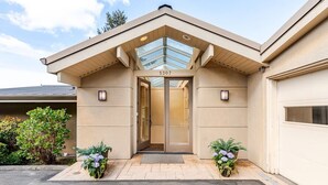 A modern building with a flat roof, a glass entryway, and the number 5307 on the door. - Pritchard's Perch - private 2.5 acre in-city property, views from every room! (Seattle)