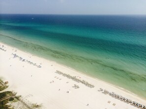 On the beach, sun-loungers
