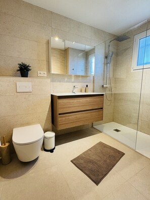 Bathtub, hair dryer, towels, soap