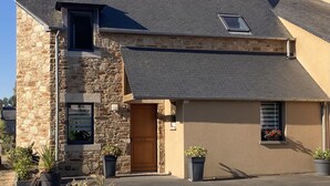 A two-story house with a stone facade, a dark roof, and a small window. - 3-STAR FISHERMAN'S STYLE HOUSE IN CANCALE 300M FROM THE PORT QUIET AREA (Cancale)