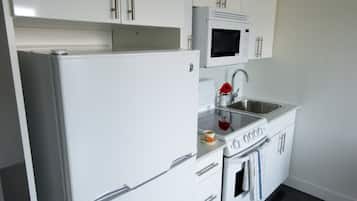 Fridge, microwave, stovetop, cookware/dishes/utensils
