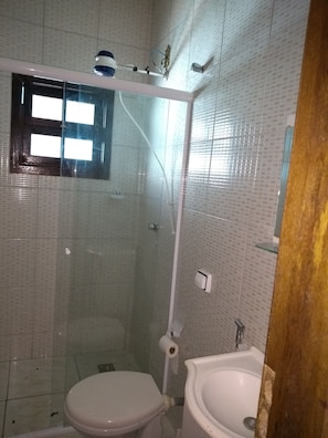 Shower, hair dryer, towels, toilet paper