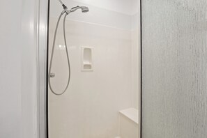 Combined shower/bathtub, hair dryer, towels, soap