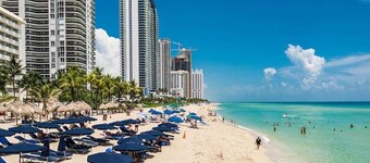 F- Beautiful view of pool and gardens!  Walk to beach!