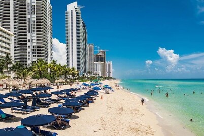302 -  Beautiful view of pool and gardens!  Walk to beach!