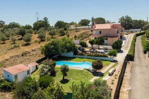 Enjoy a serene stay in this two-story house surrounded by a well-maintained garden and a clear view of the surrounding landscape.