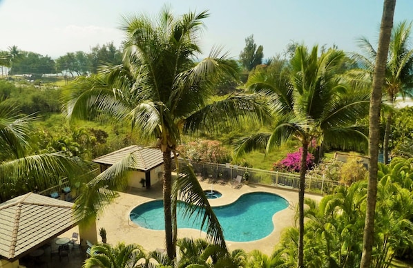 A view of a pool and B&B area from a balcony. - Studio With Ocean & Mountain Views. Last minute discount, Aug. & Sept, 20% off. (Kihei)