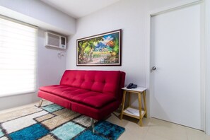 Apartamento, 1 habitación | Sala de estar | Una Smart TV, Netflix