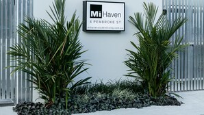 A modern building with a sign reading "Mi Haven 4 PEMBROKE ST." - Redhill Cairns Shared Living – Pembroke St (Parramatta Park)