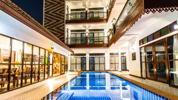 Outdoor pool, open 9:00 AM to 10:00 PM, pool loungers