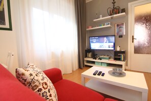 Appartement Deluxe, 1 grand lit, fumeur | Coin séjour