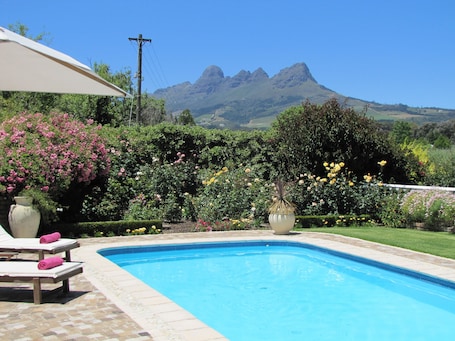 Lavender Cottage | Pool | Outdoor pool, pool umbrellas, sun loungers