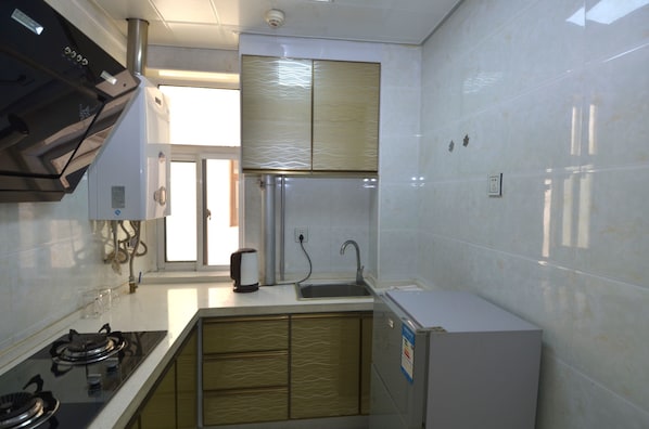 Suite, 1 Bedroom | Private kitchen | Fridge, stovetop, rice cooker, cookware/dishes/utensils