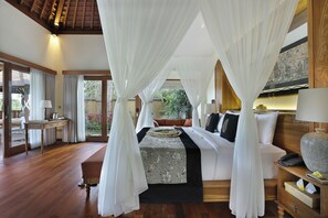 A bedroom with a canopy bed, wooden flooring, and a view of the outdoors. - The Kayon Jungle Resort (Payangan)