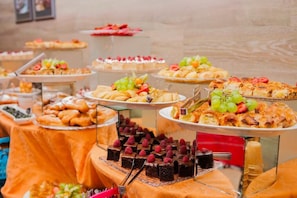 A buffet with various desserts and snacks. - Effect Grand Victoria Hotel (Sunny Beach)