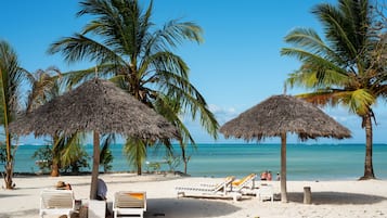On the beach, beach umbrellas, beach massages