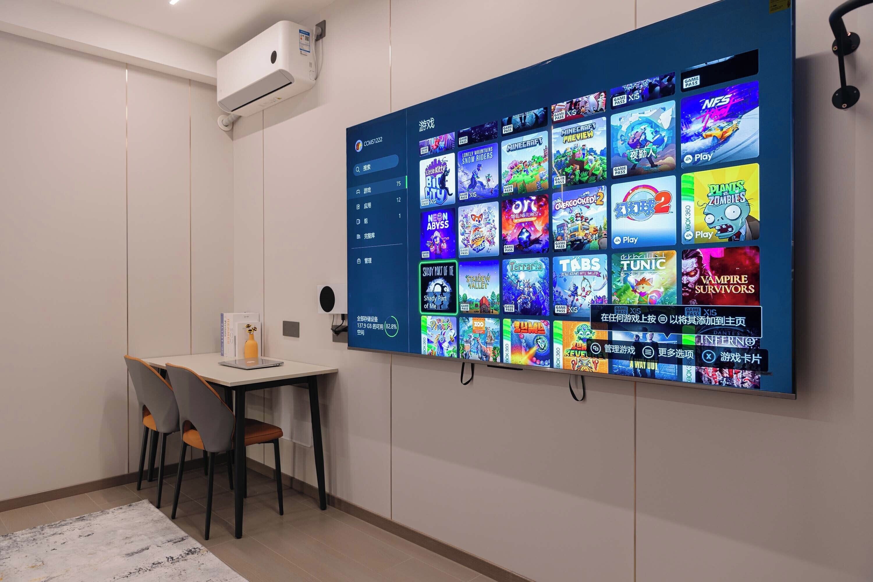 A wall-mounted display with a variety of video game covers.