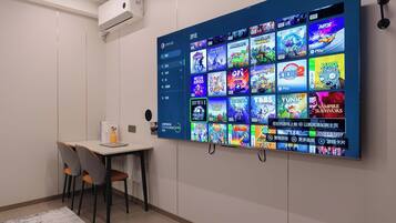 A wall-mounted display with a variety of video game covers.