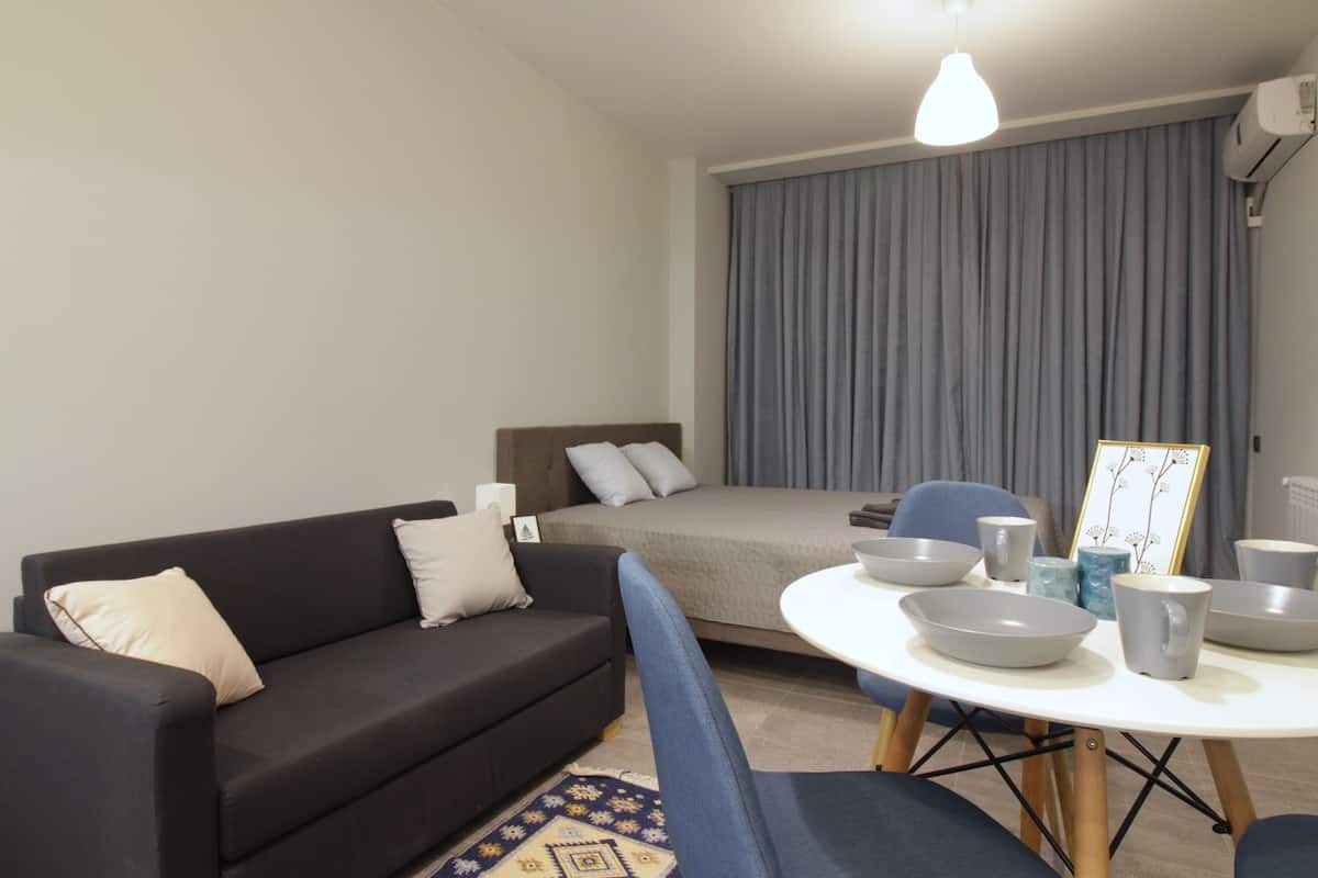 Studio, Beach View | Living area | Flat-screen TV
