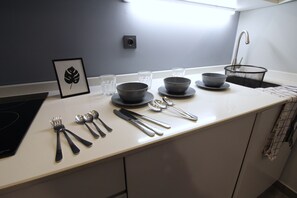 Fridge, oven, cookware/dishes/utensils