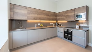 Luxury Duplex, 3 Bedrooms, Non Smoking | Private kitchen | Full-size fridge, oven, stovetop, dishwasher