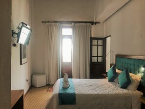 Suite, Private Bathroom, Garden View | In-room safe, desk, iron/ironing board, free WiFi