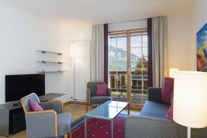 Comfort Apartment, 1 Bedroom | Living room | Flat-screen TV - Hapimag Resort Flims (Flims)