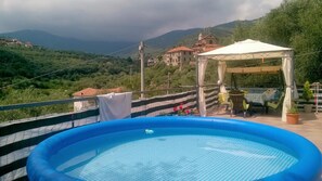 Seasonal outdoor pool, open 8 AM to 9 PM, pool loungers