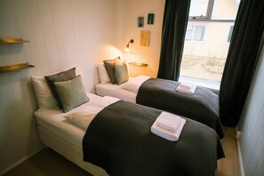 Apartment, 2 Bedrooms, Ground Floor | Desk, blackout drapes, iron/ironing board, free cribs/infant beds