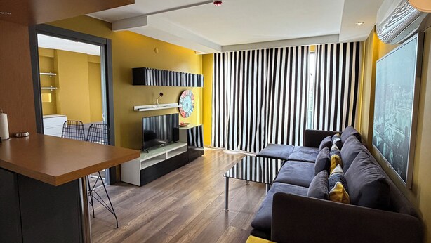 Executive Condo | Living area | 42-inch LED TV with satellite channels - Deluxe Beach Residence (Atakum)