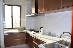 Suite, 2 Bedrooms | Private kitchenette | Full-size fridge, stovetop, rice cooker, cookware/dishes/utensils