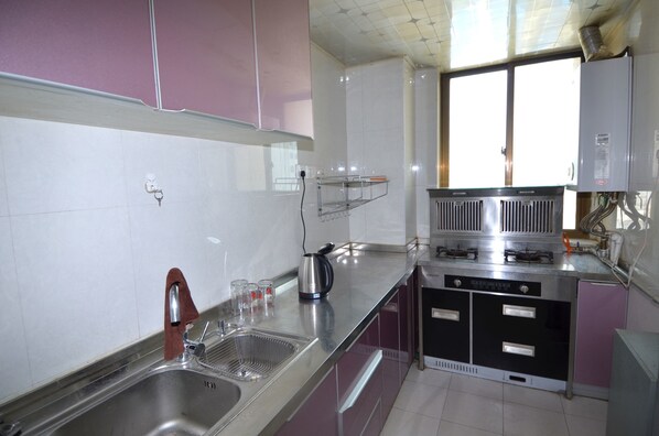 Suite, 2 Bedrooms | Private kitchenette | Fridge, stovetop, rice cooker, cookware/dishes/utensils