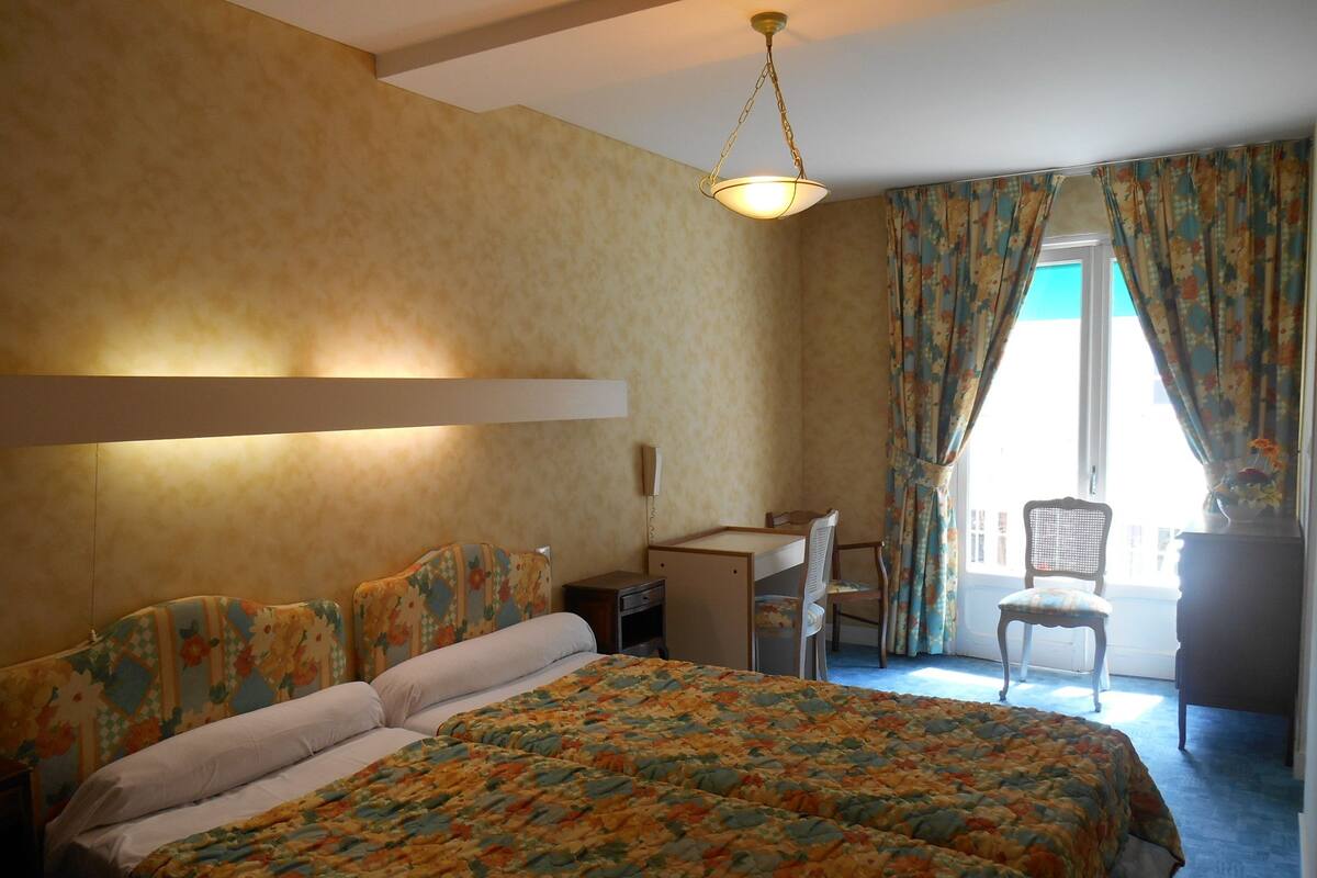 Twin Room, City View | Blackout drapes, bed sheets